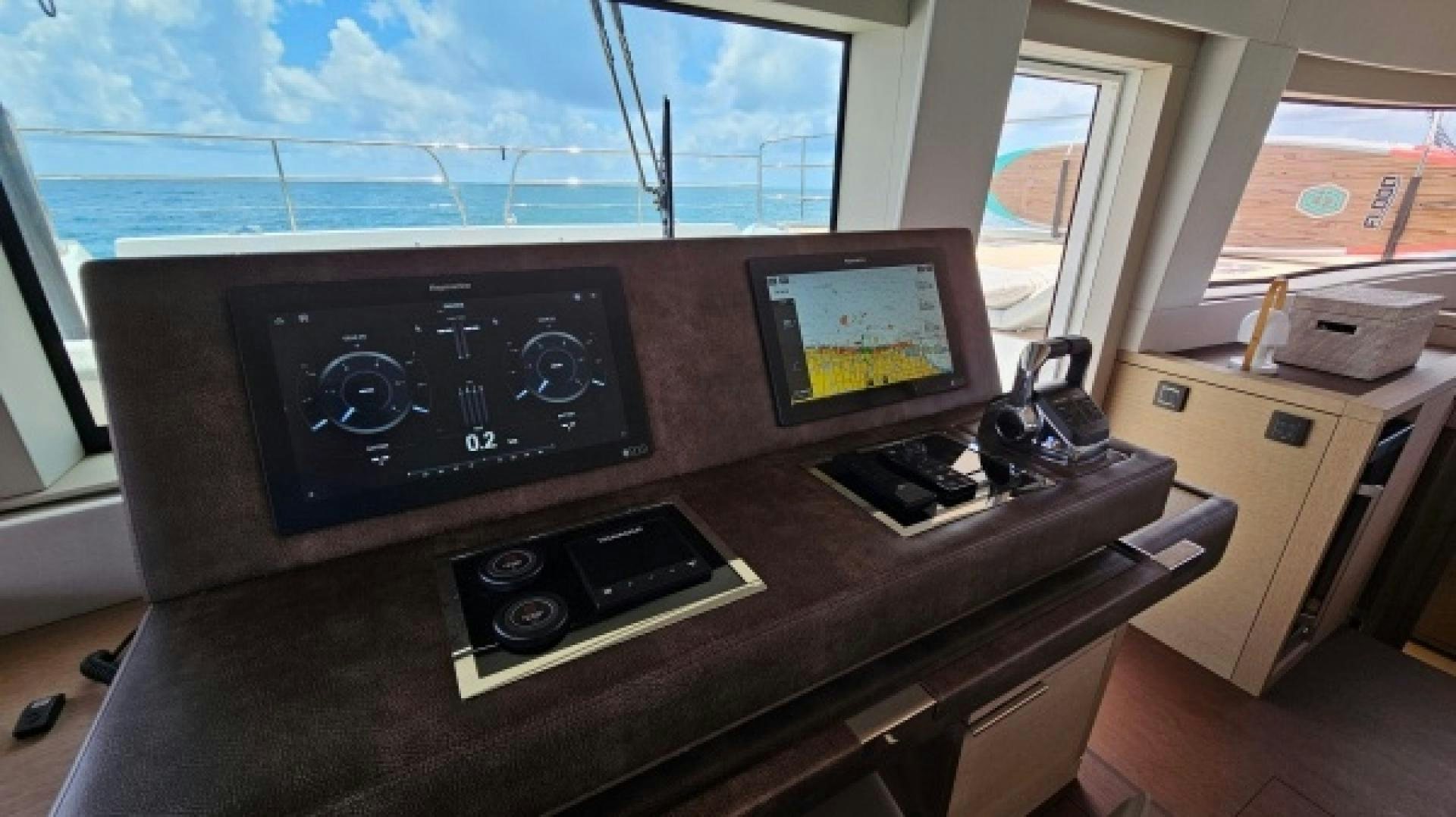 a control panel on a table aboard SUNLOVE Yacht for Sale