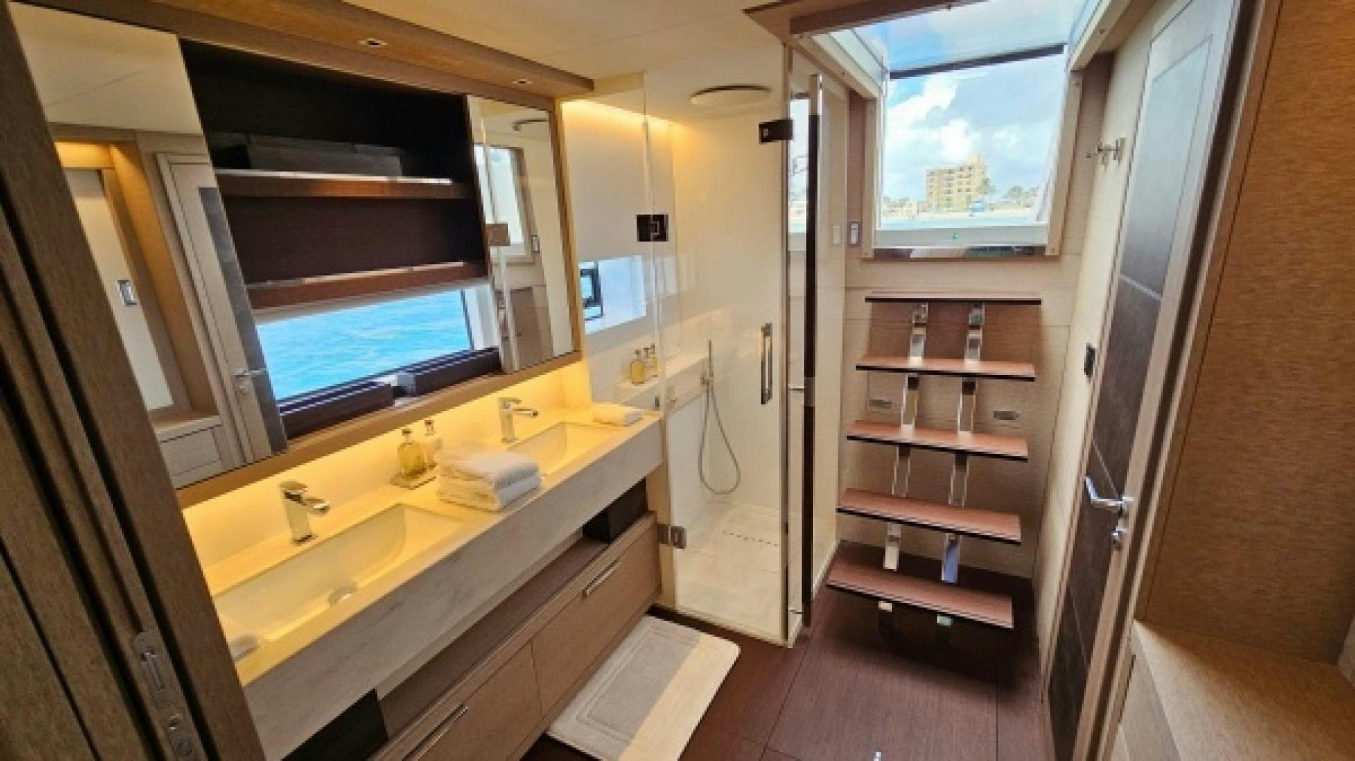 a bathroom with a sink and cabinets aboard SUNLOVE Yacht for Sale