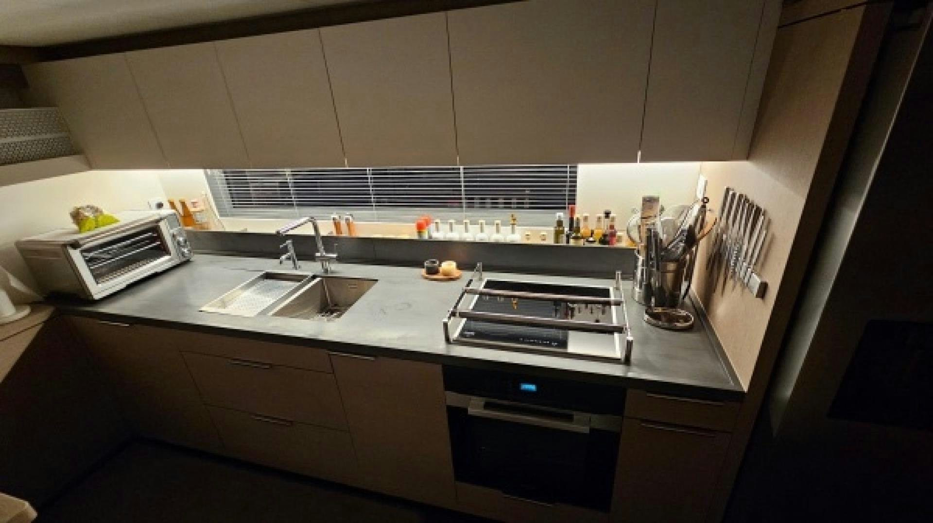 a kitchen with a stove and sink aboard SUNLOVE Yacht for Sale