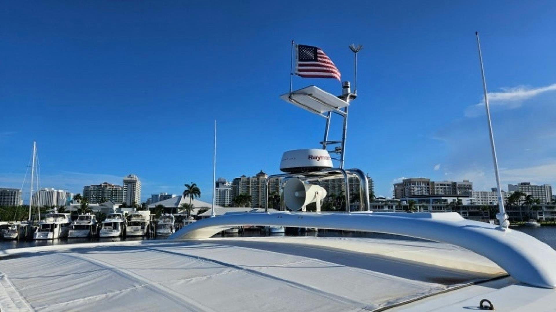 a large ship with a flag on it aboard SUNLOVE Yacht for Sale