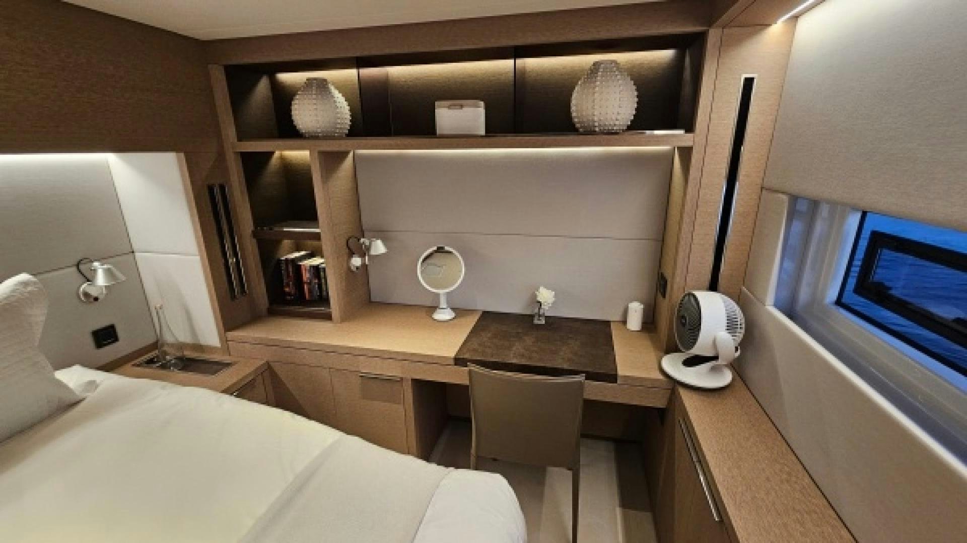 a room with a bed and a television aboard SUNLOVE Yacht for Sale