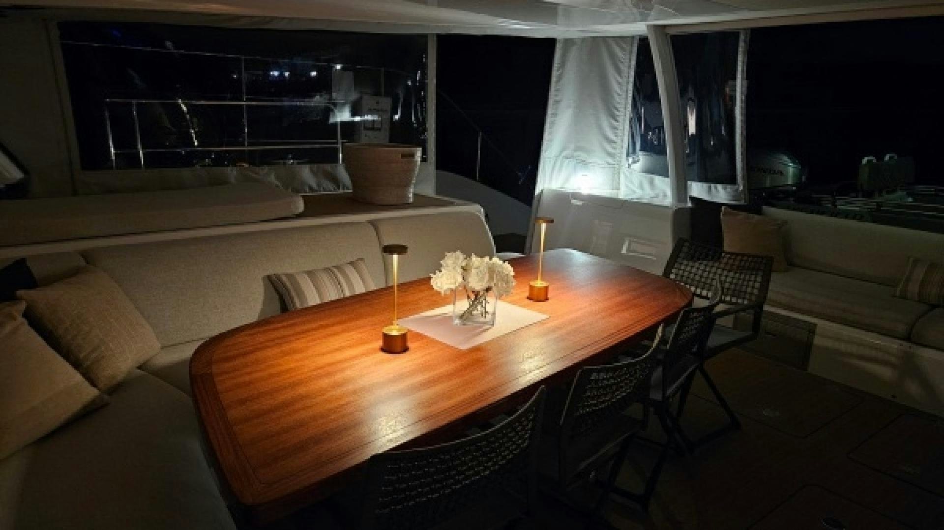 a table with candles on it aboard SUNLOVE Yacht for Sale