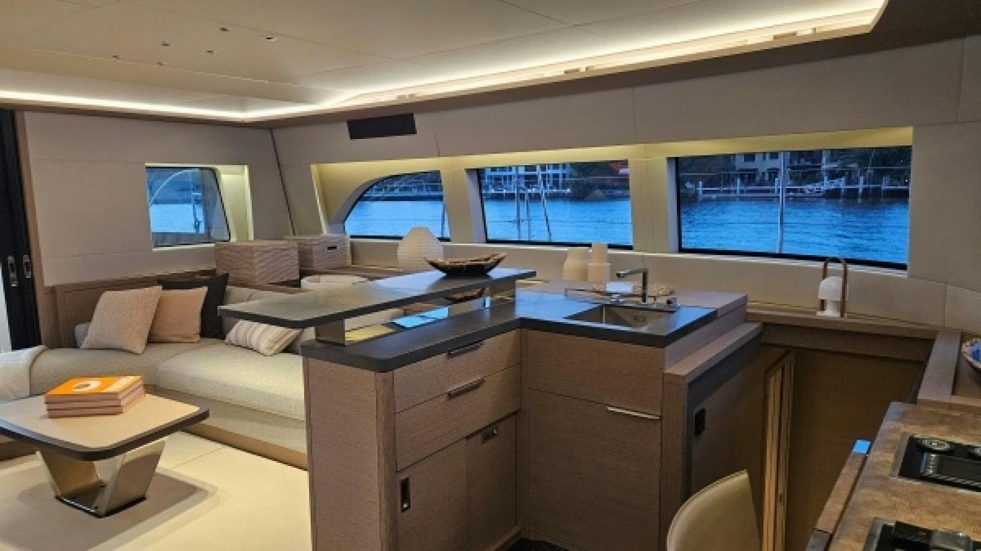 a kitchen with a couch and a table aboard SUNLOVE Yacht for Sale