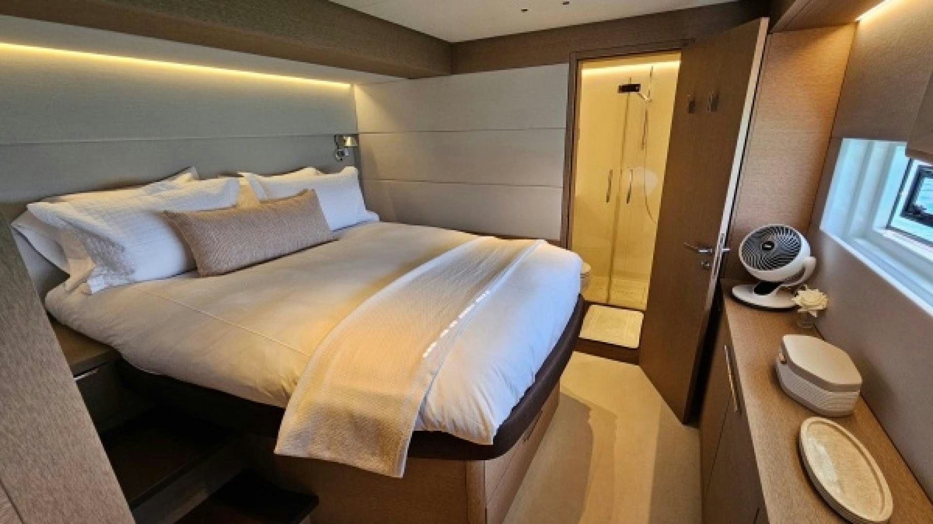 a bed in a room aboard SUNLOVE Yacht for Sale