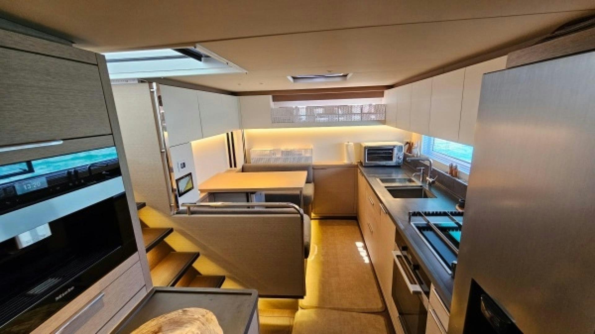 a room with computers and a tv aboard SUNLOVE Yacht for Sale