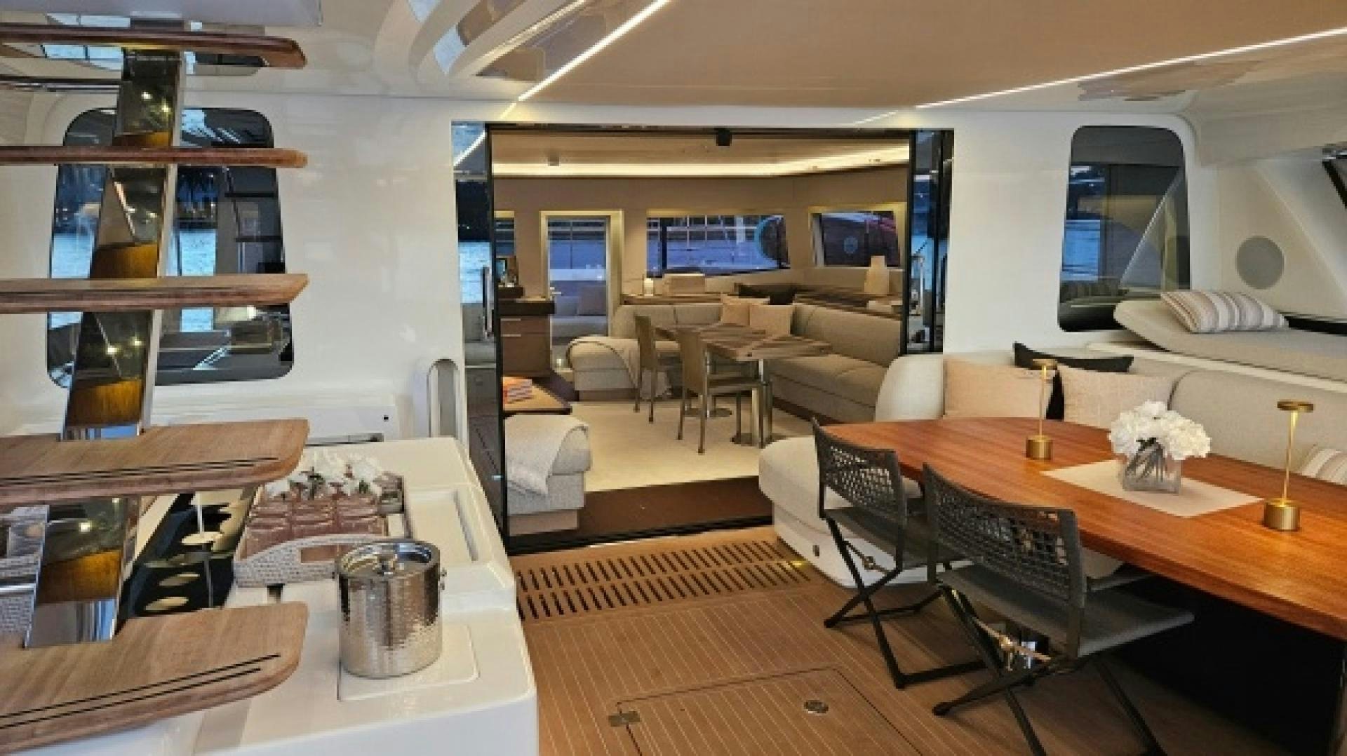a room with tables and chairs aboard SUNLOVE Yacht for Sale