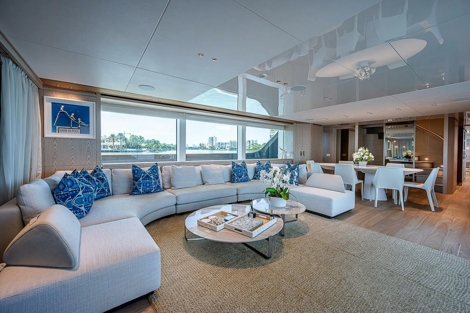 a living room with a large window aboard F 118 Yacht for Sale