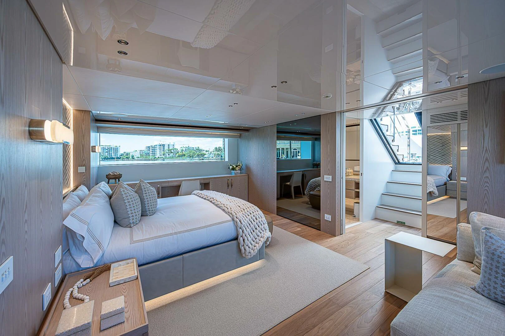 a bedroom with a bed and a table aboard F 118 Yacht for Sale