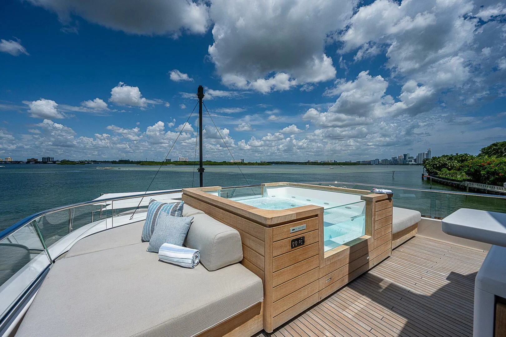 a balcony with a view of the ocean and a beach aboard F 118 Yacht for Sale