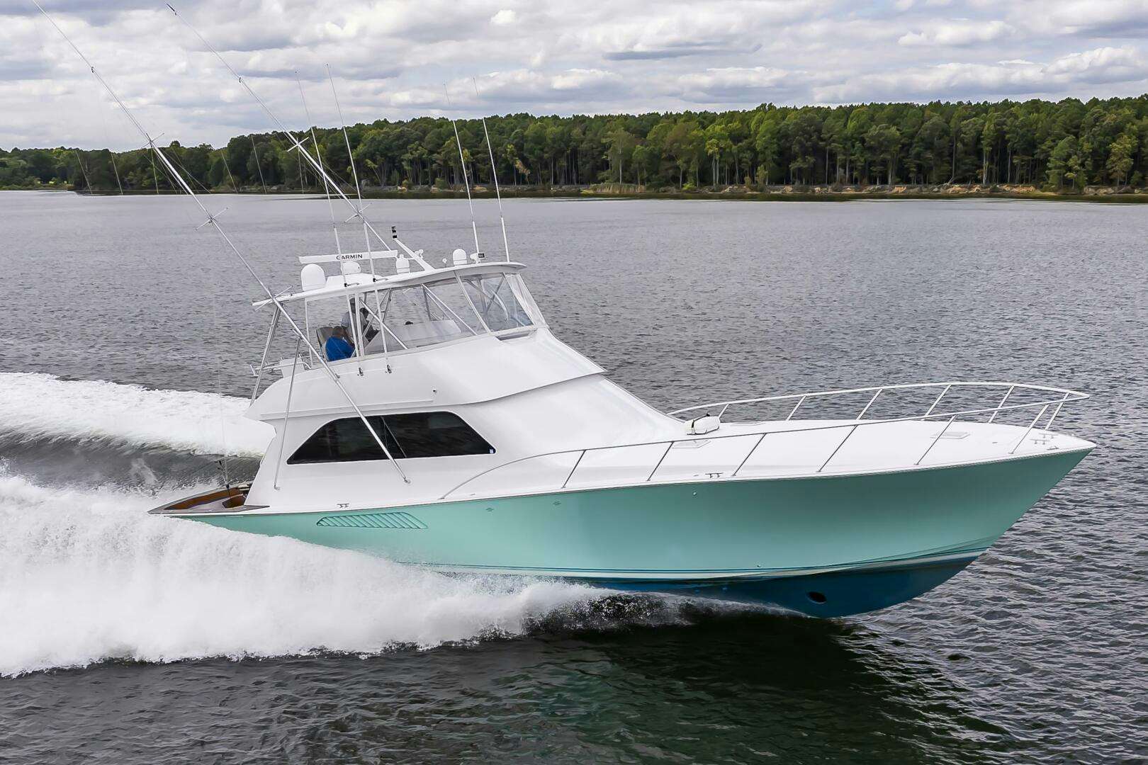 a white boat on the water aboard TIMELESS Yacht for Sale