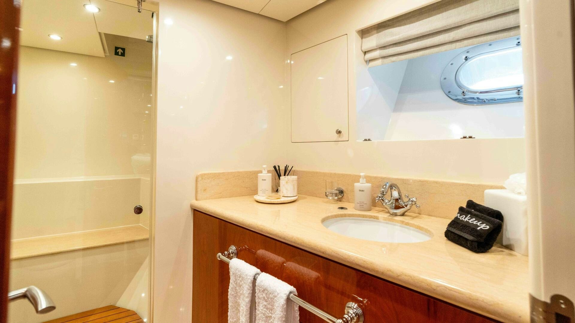 a bathroom with a sink and a phone on the counter aboard STAY SALTY Yacht for Sale