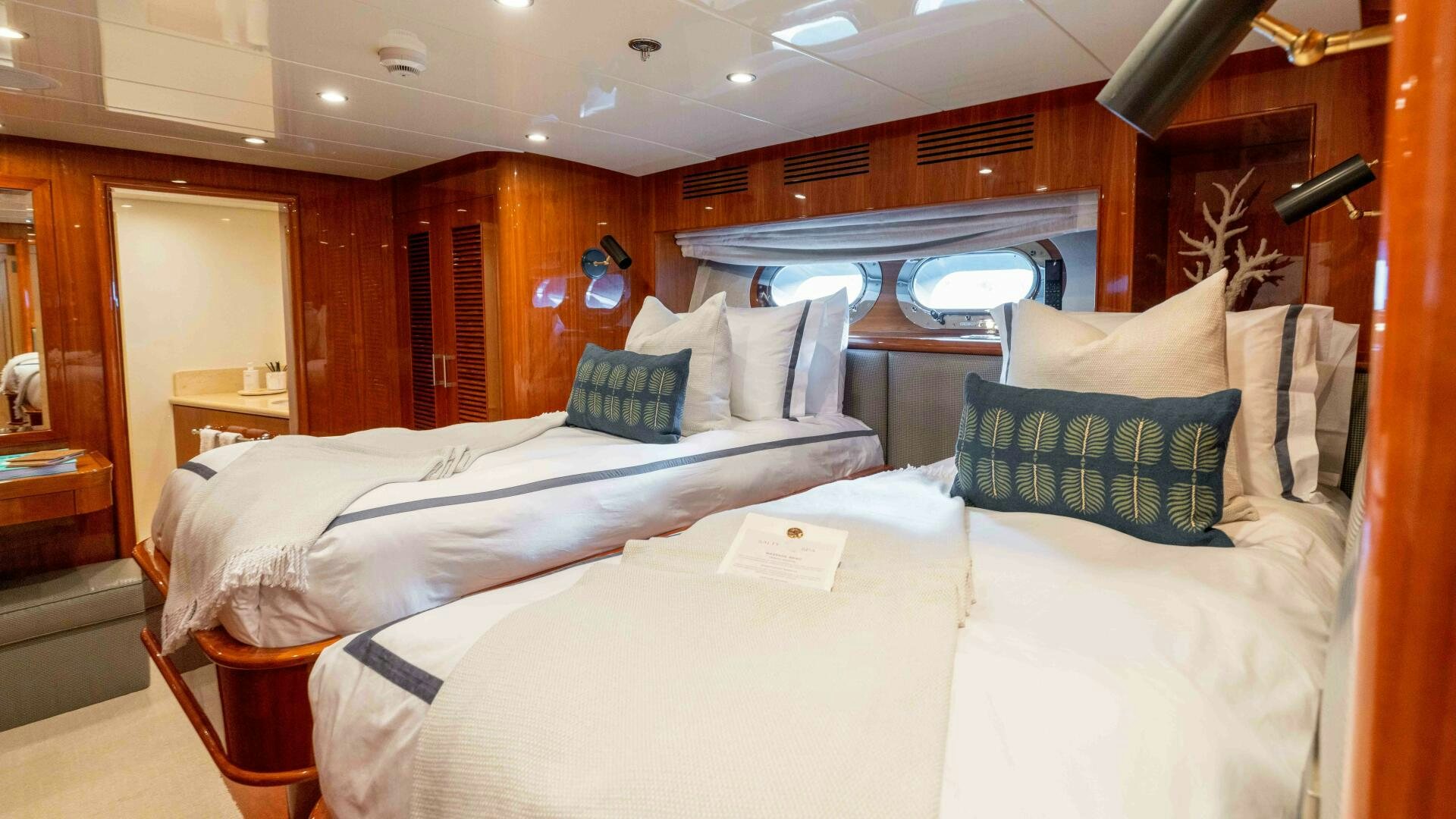 a room with two beds aboard STAY SALTY Yacht for Sale