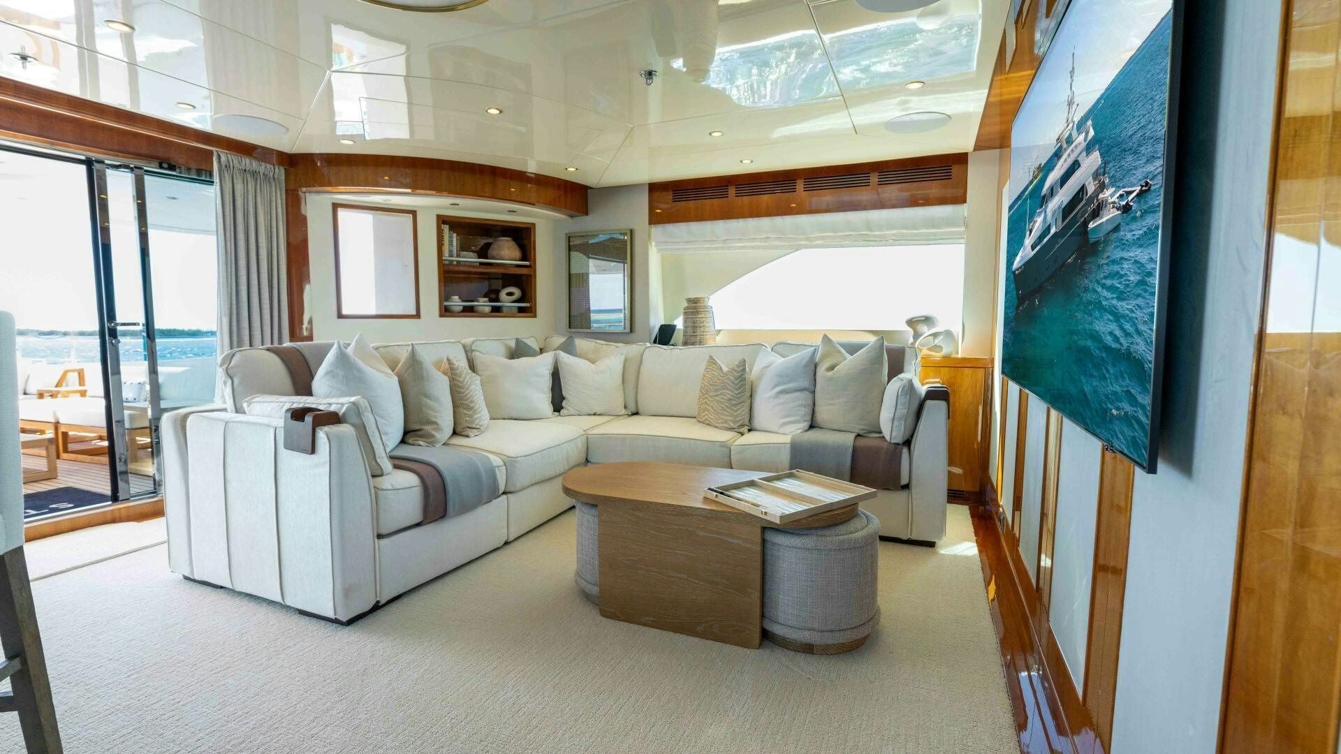a living room with a large screen aboard STAY SALTY Yacht for Sale