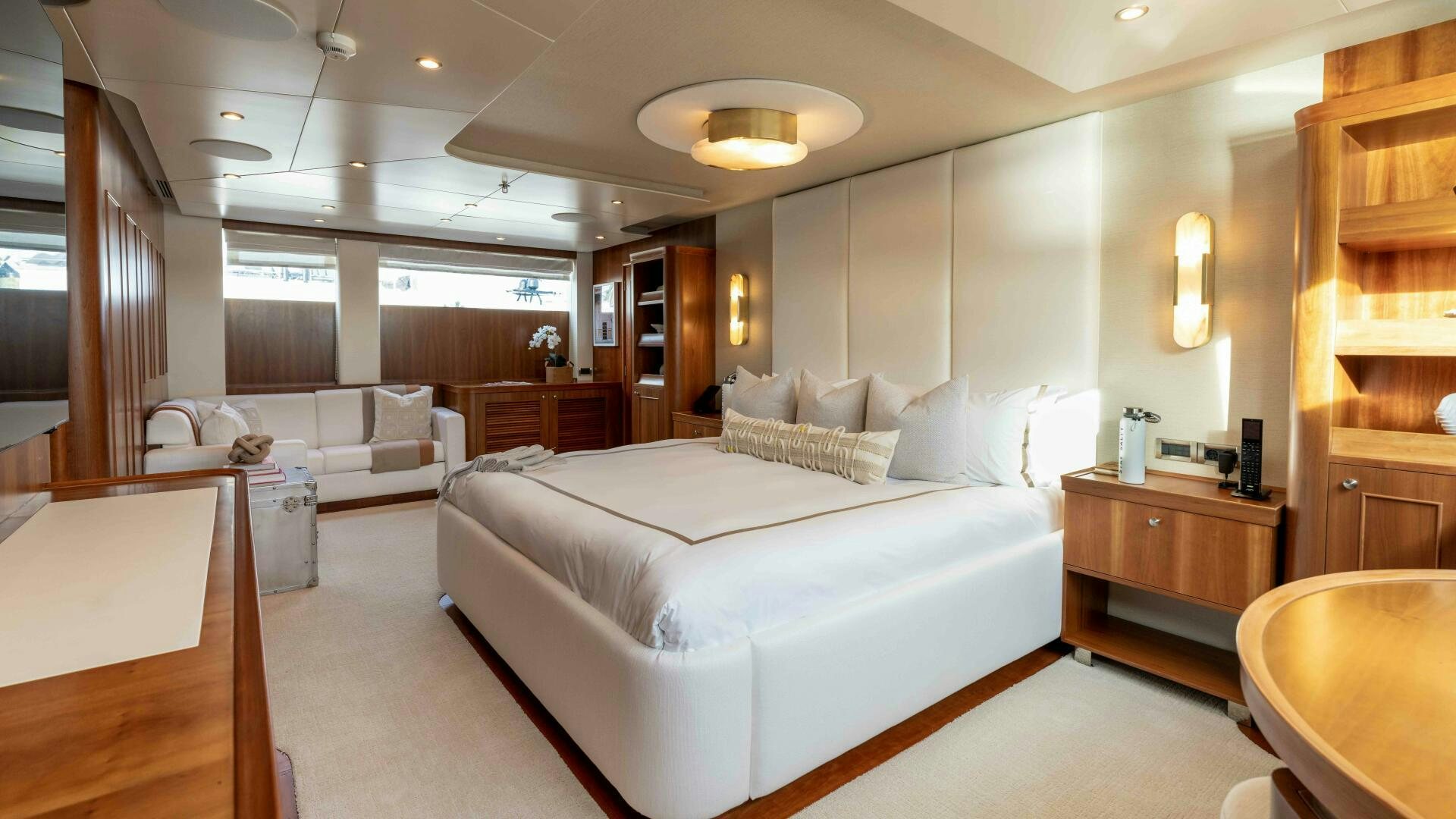 a large room with a bed and a couch aboard STAY SALTY Yacht for Sale