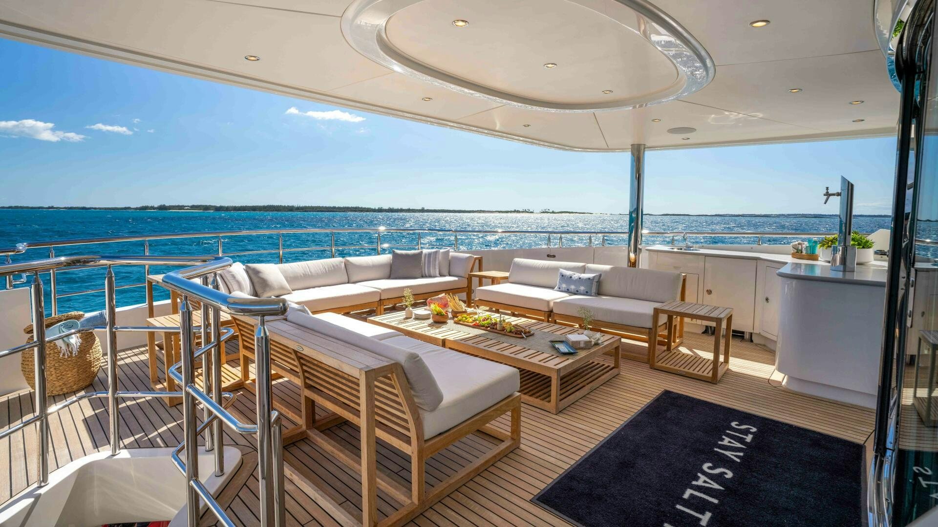 a room with a table and chairs aboard STAY SALTY Yacht for Sale