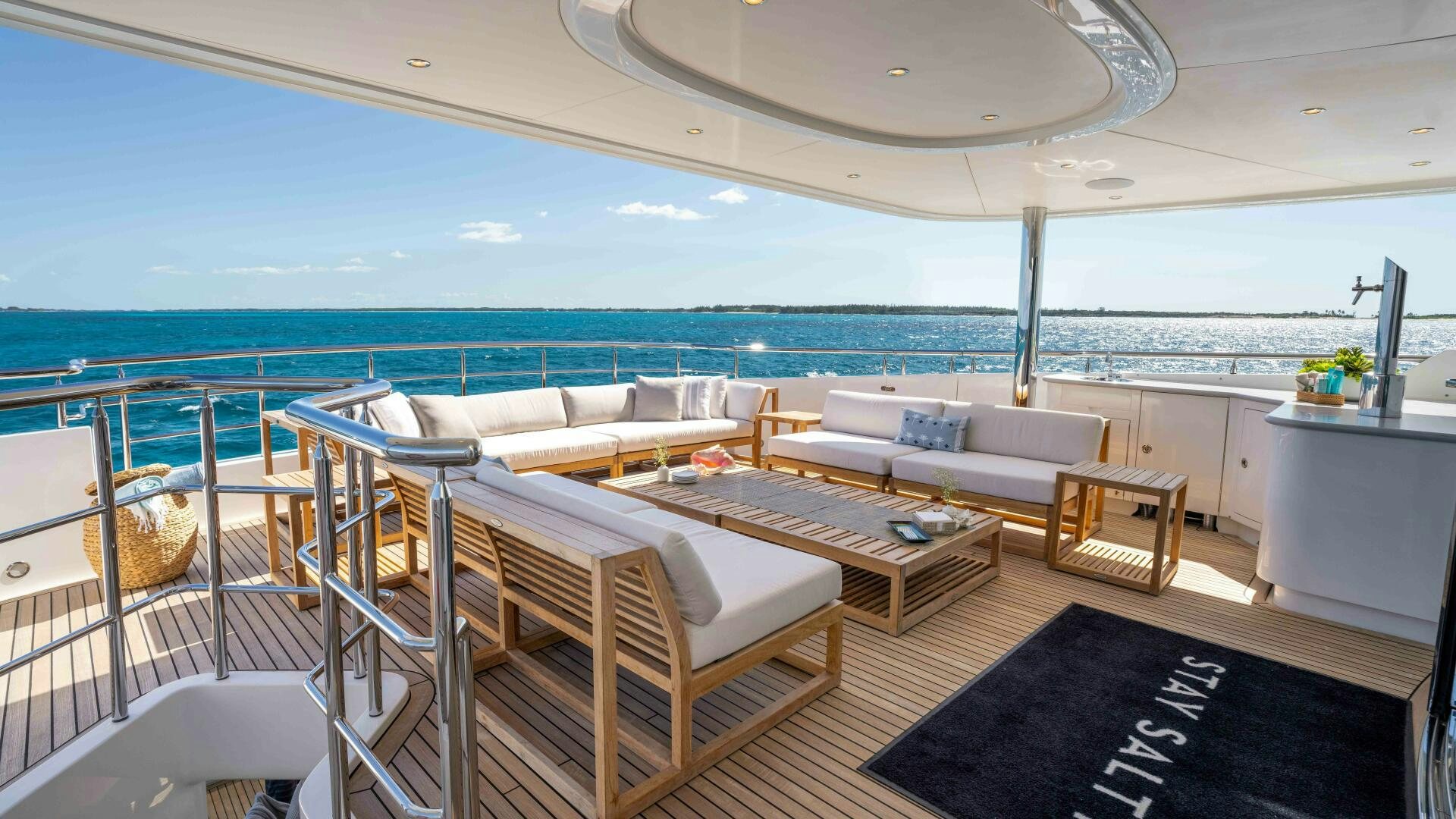 a room with a couch and a table and chairs aboard STAY SALTY Yacht for Sale