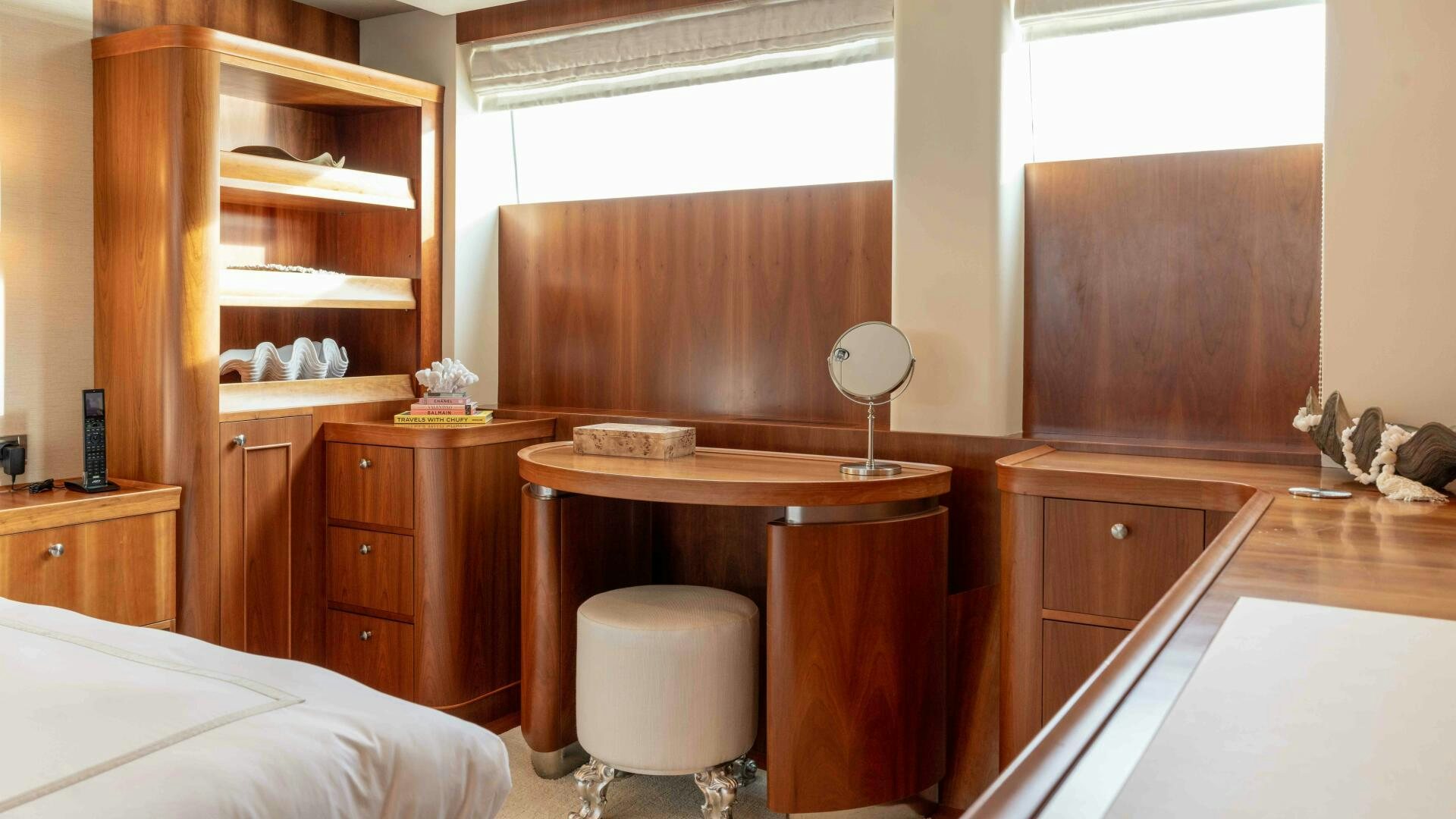 a bedroom with a desk and a bed aboard STAY SALTY Yacht for Sale
