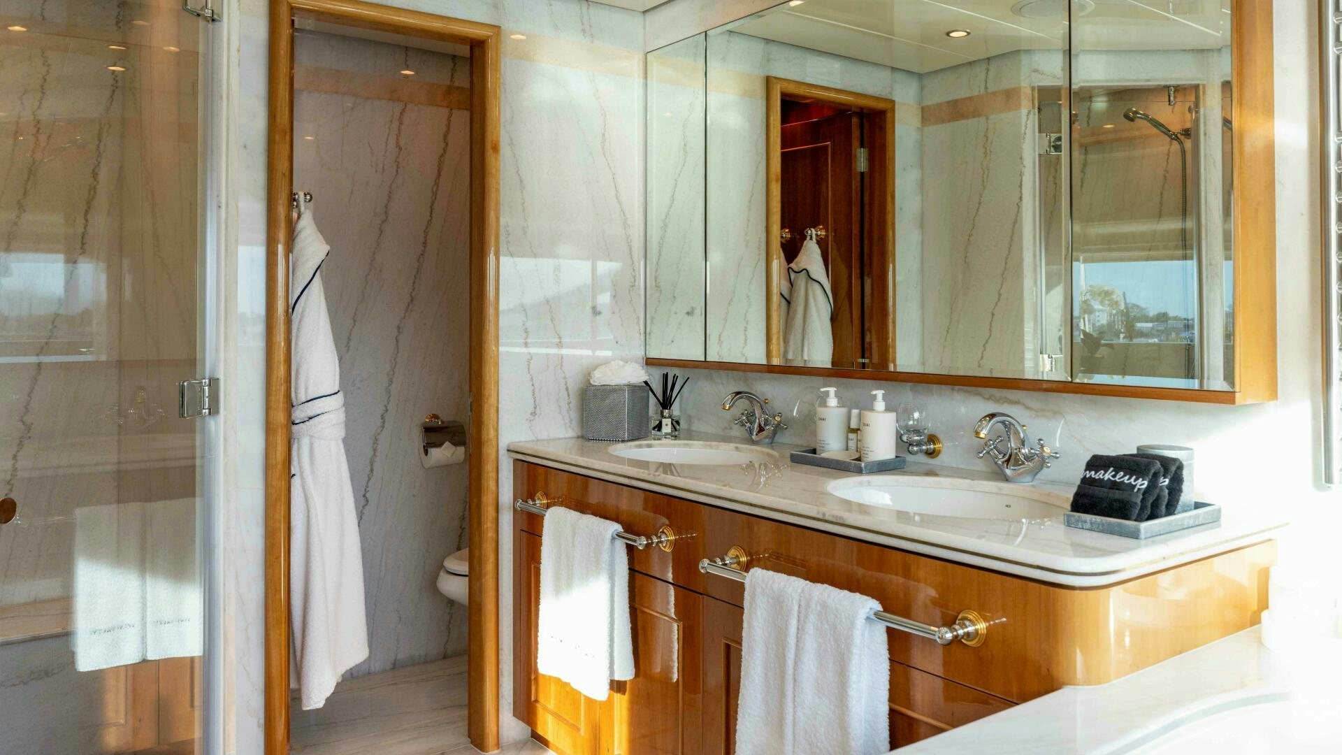 a bathroom with a sink and a mirror aboard STAY SALTY Yacht for Sale