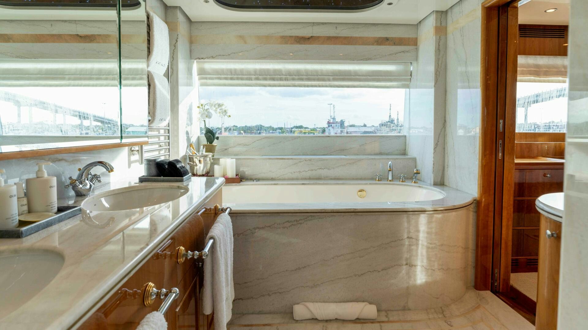 a bathroom with a tub sink and sinks aboard STAY SALTY Yacht for Sale
