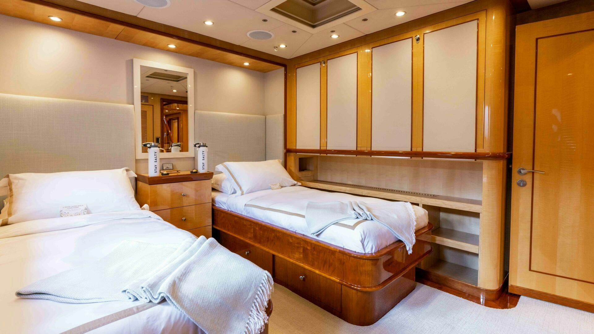 a room with a couple of beds aboard STAY SALTY Yacht for Sale
