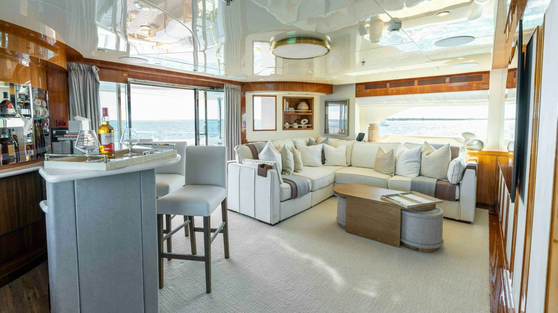 a living room with a couch and a table aboard STAY SALTY Yacht for Sale