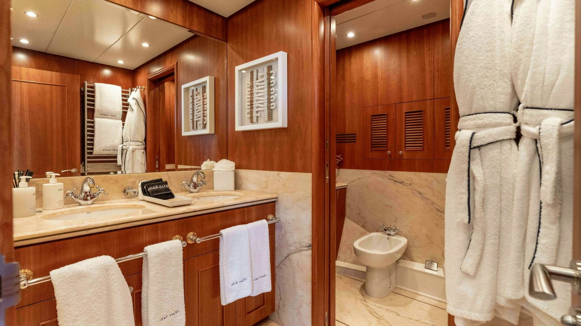 a bathroom with a large mirror aboard STAY SALTY Yacht for Sale