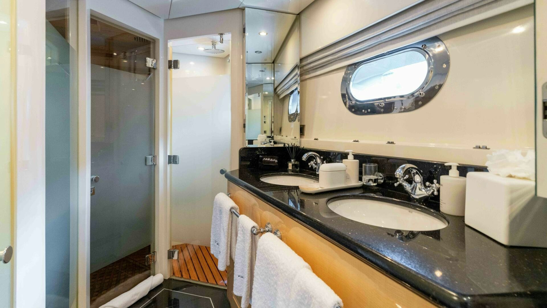 a bathroom with a sink and a mirror aboard STAY SALTY Yacht for Sale