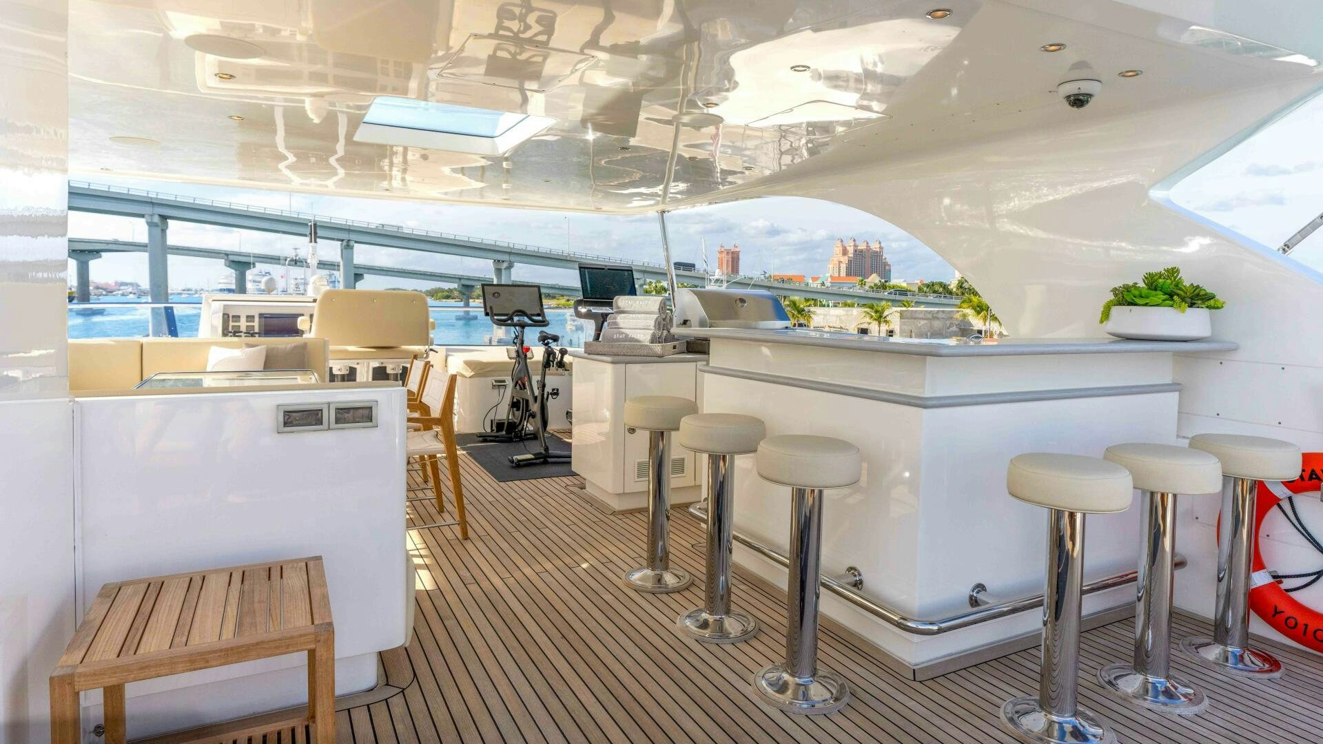 a room with stools and stools and a table aboard STAY SALTY Yacht for Sale