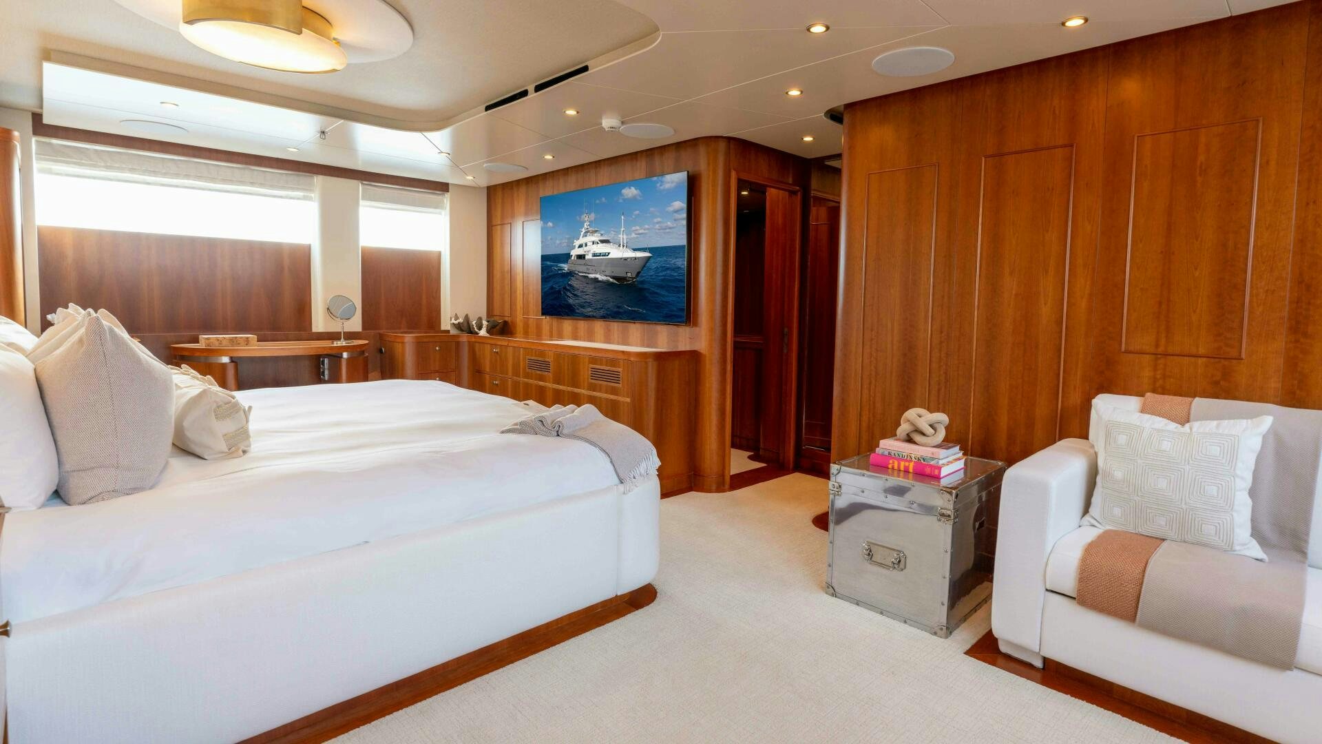 a room with a bed and a couch aboard STAY SALTY Yacht for Sale