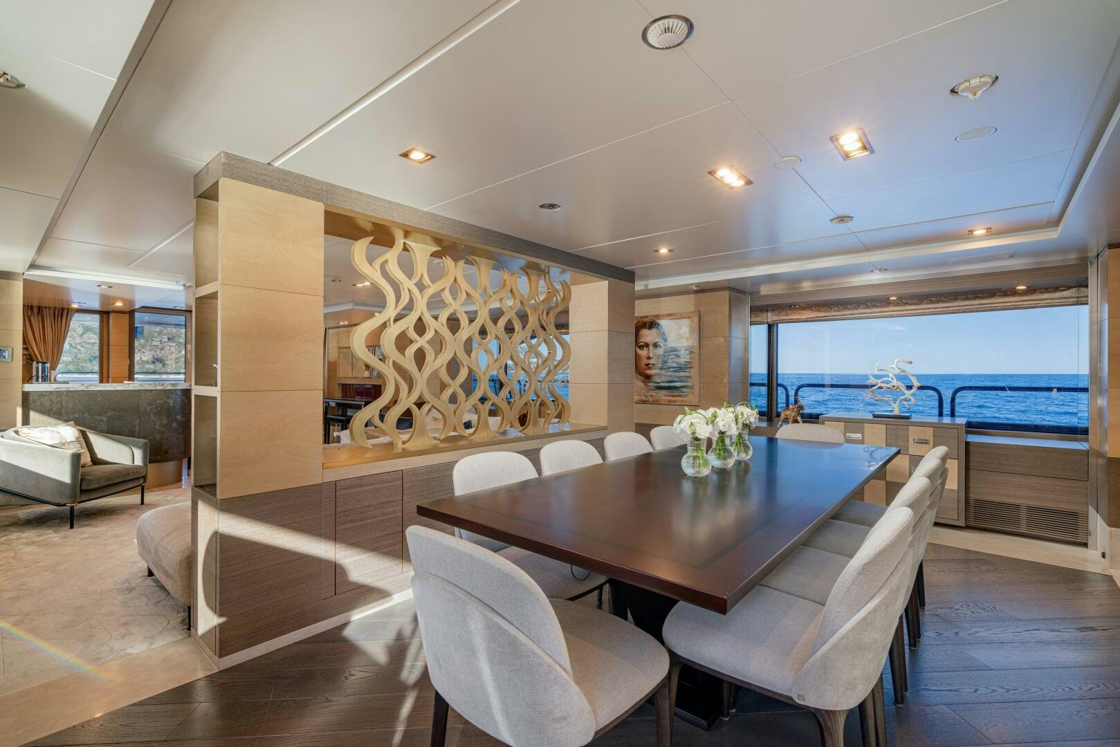 a large dining table in a room aboard JUSTA DELIA Yacht for Sale