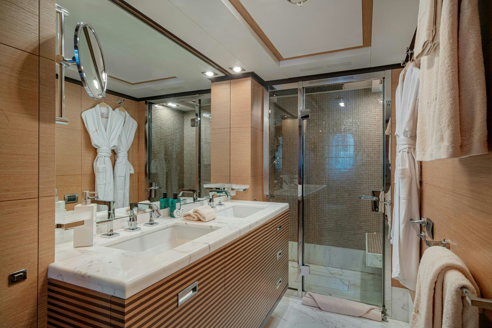 a bathroom with a large mirror aboard JUSTA DELIA Yacht for Sale