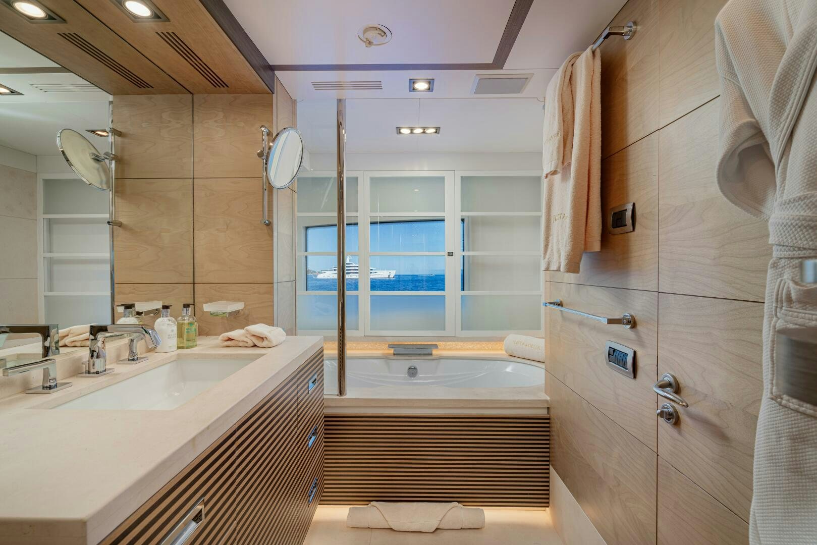 a bathroom with a large mirror aboard JUSTA DELIA Yacht for Sale