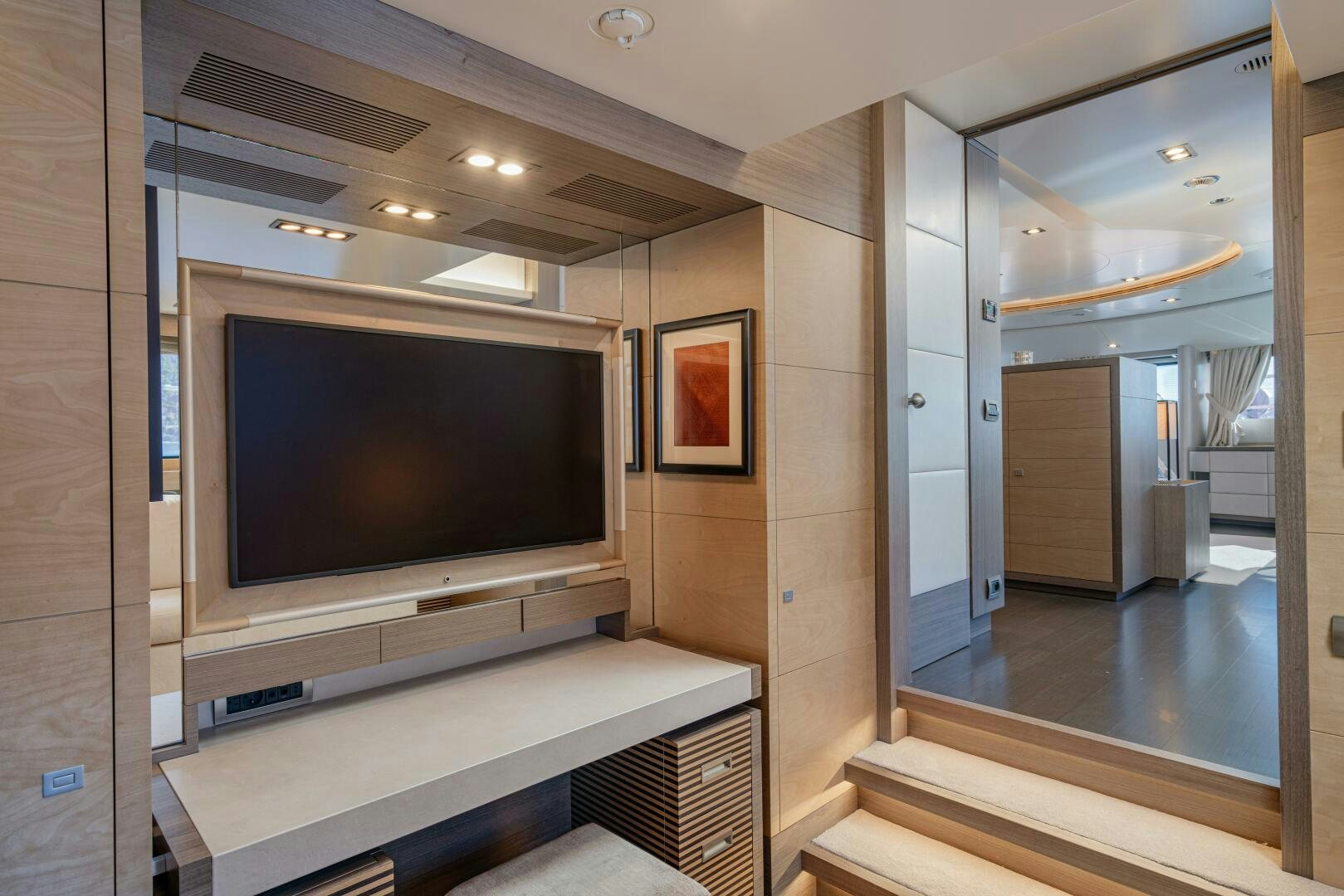a room with a tv and a mirror aboard JUSTA DELIA Yacht for Sale