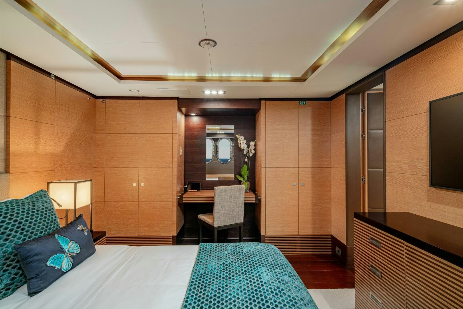 a hotel room with a bed and desk aboard JUSTA DELIA Yacht for Sale