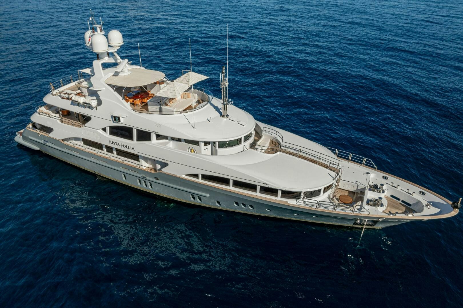 a large white ship in the water aboard JUSTA DELIA Yacht for Sale