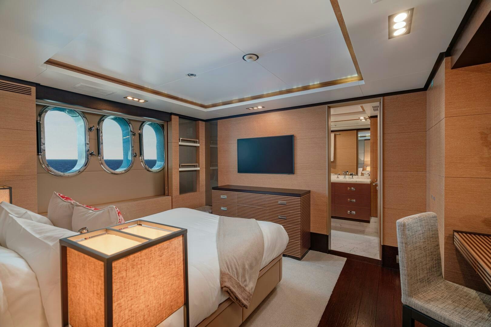 a room with a bed and a tv on the wall aboard JUSTA DELIA Yacht for Sale