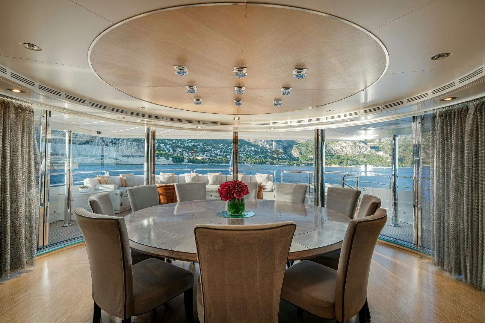 a dining room with a large table and chairs aboard JUSTA DELIA Yacht for Sale