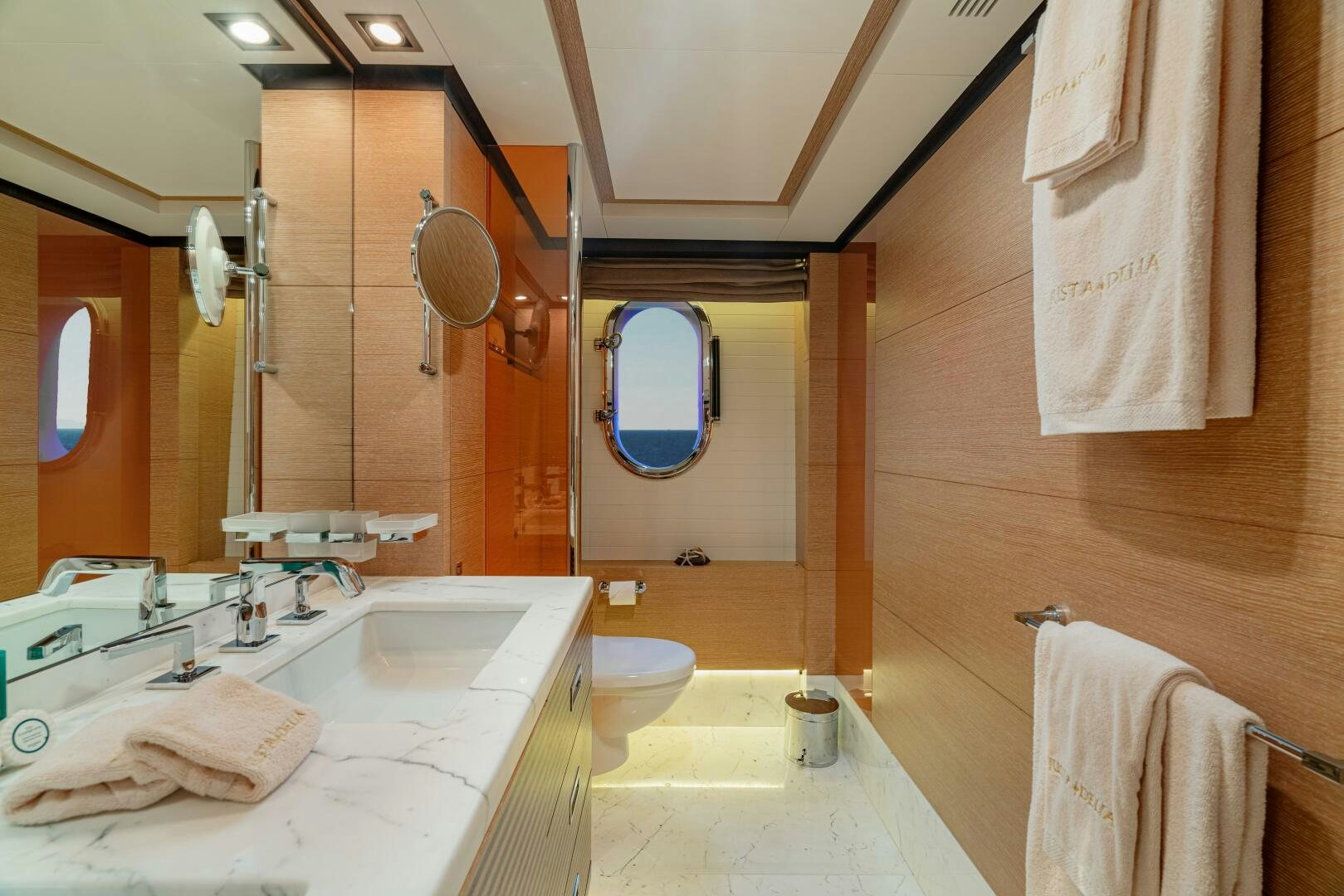 a bathroom with a large mirror aboard JUSTA DELIA Yacht for Sale