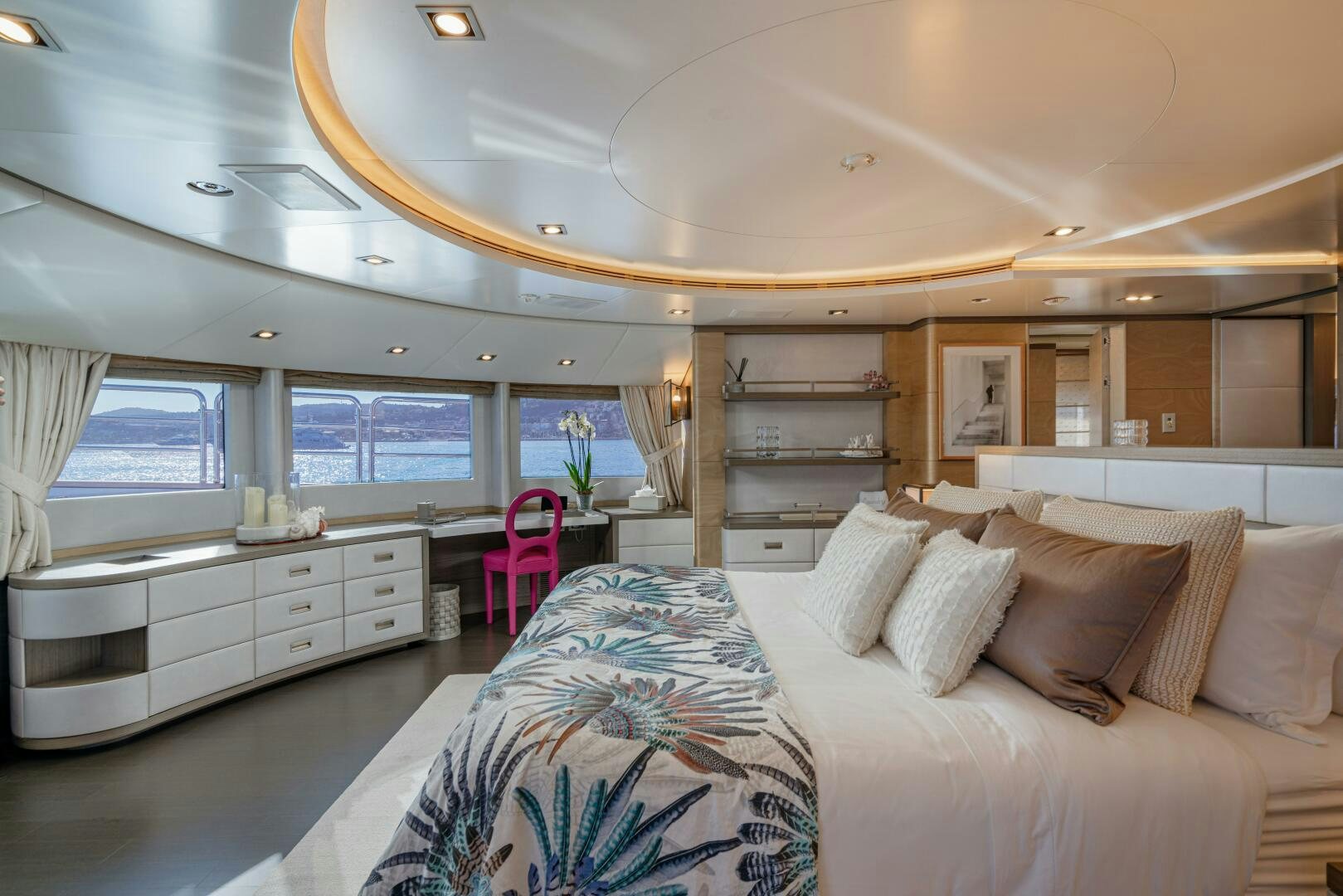 a bedroom with a bed and a desk aboard JUSTA DELIA Yacht for Sale