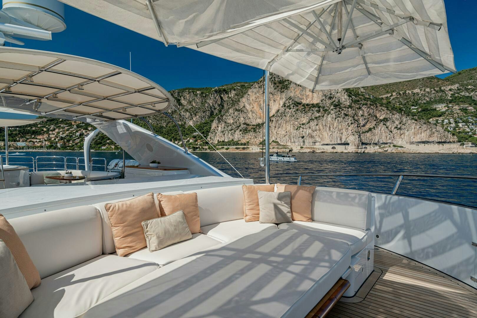 a large bed with a white umbrella aboard JUSTA DELIA Yacht for Sale