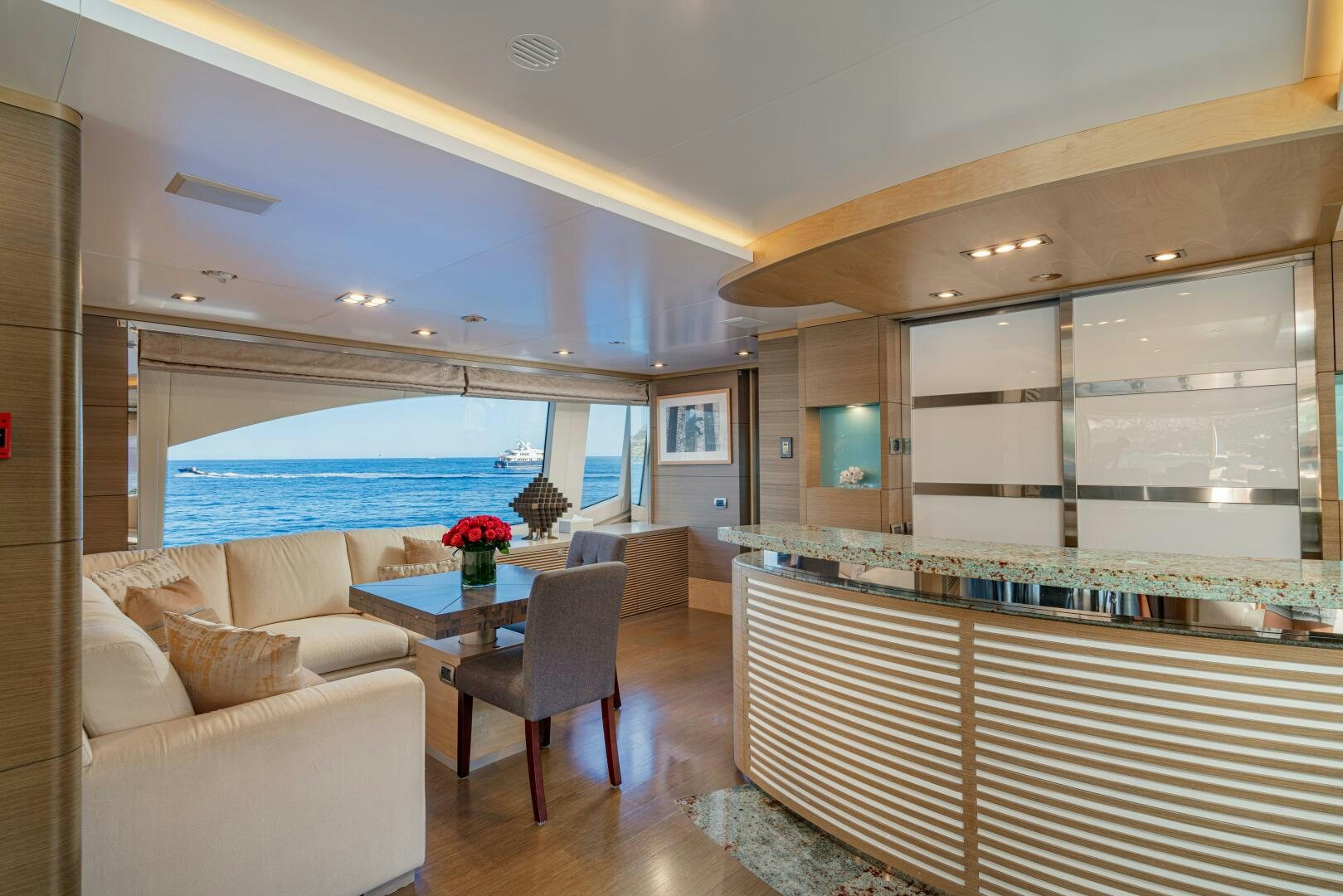 a living room with a large swimming pool aboard JUSTA DELIA Yacht for Sale