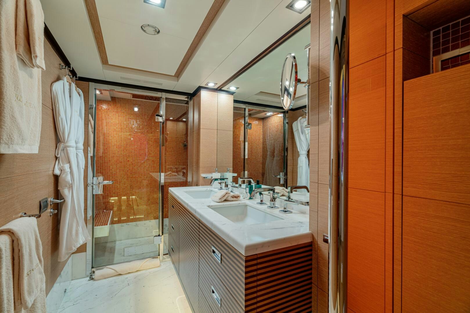 a bathroom with a large mirror aboard JUSTA DELIA Yacht for Sale
