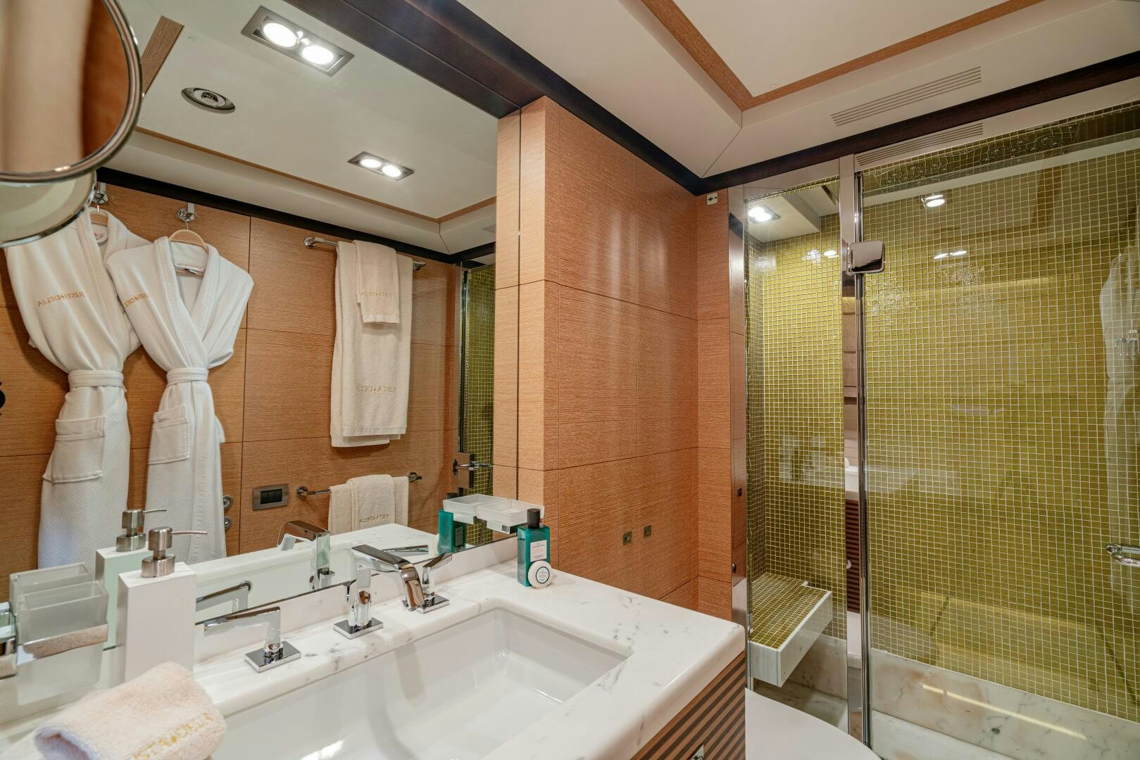 a bathroom with a large mirror aboard JUSTA DELIA Yacht for Sale