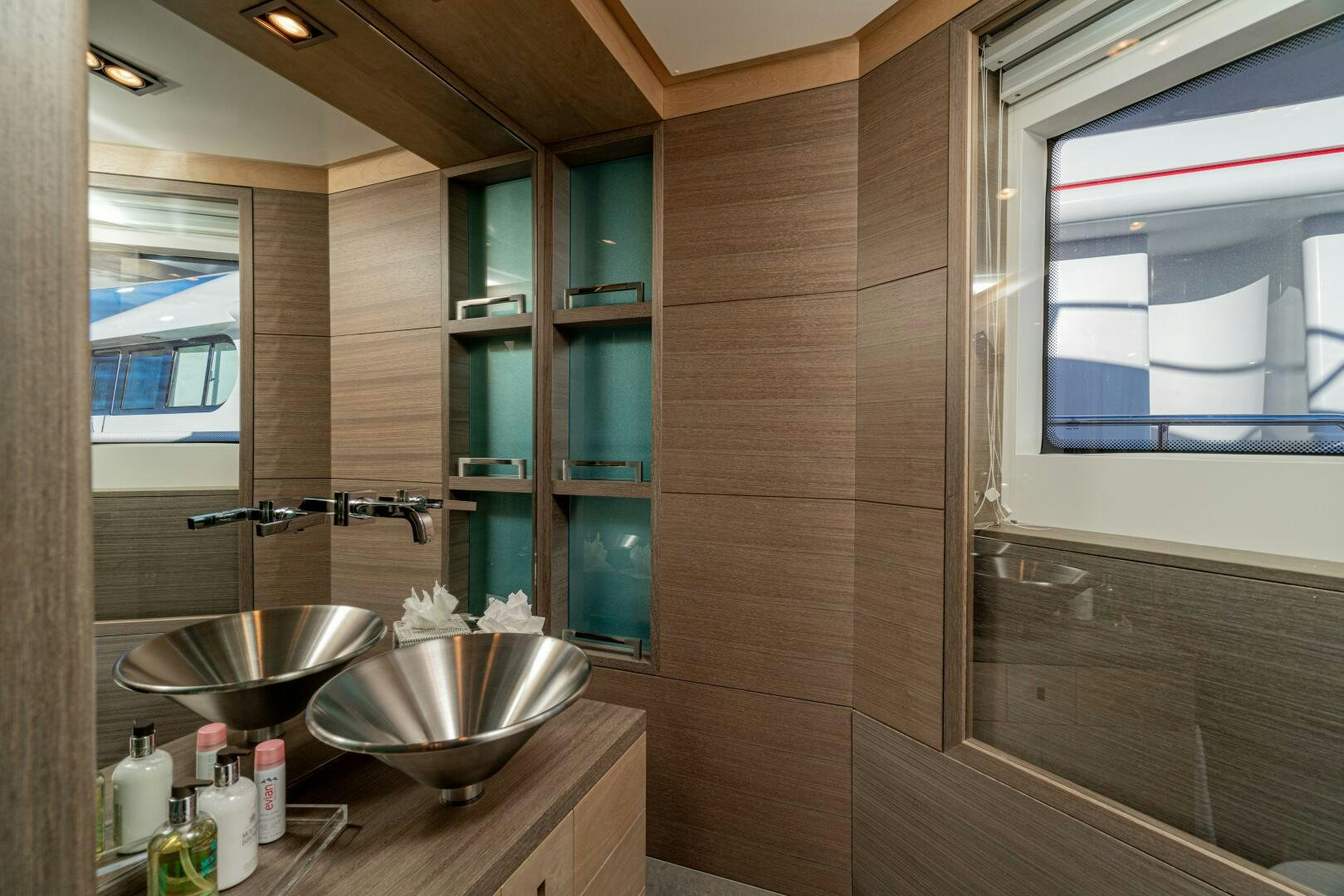 a bathroom with a sink and a window aboard JUSTA DELIA Yacht for Sale