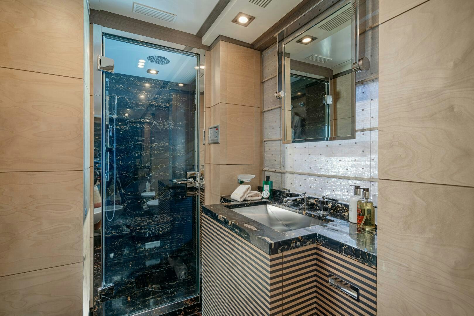 a bathroom with a glass door aboard JUSTA DELIA Yacht for Sale