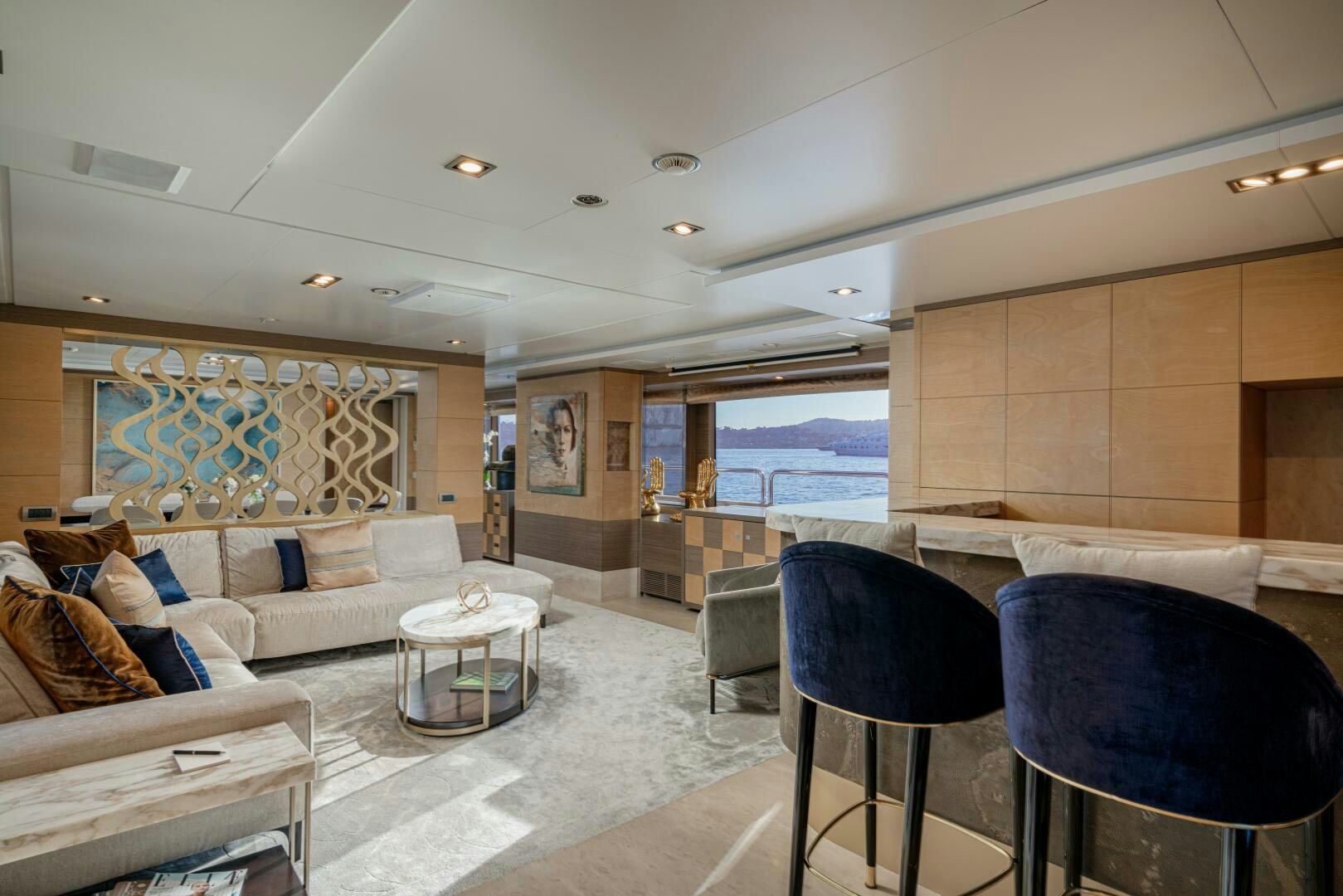 a living room with a couch and a table aboard JUSTA DELIA Yacht for Sale