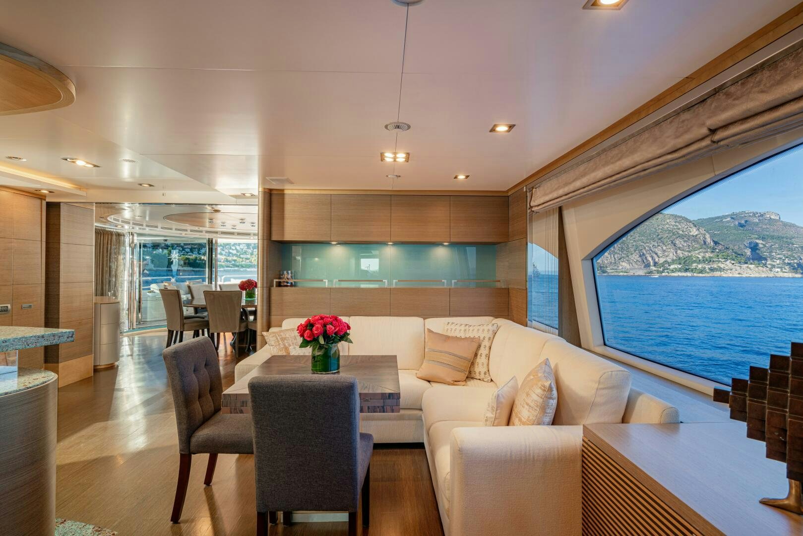 a room with a table and chairs aboard JUSTA DELIA Yacht for Sale