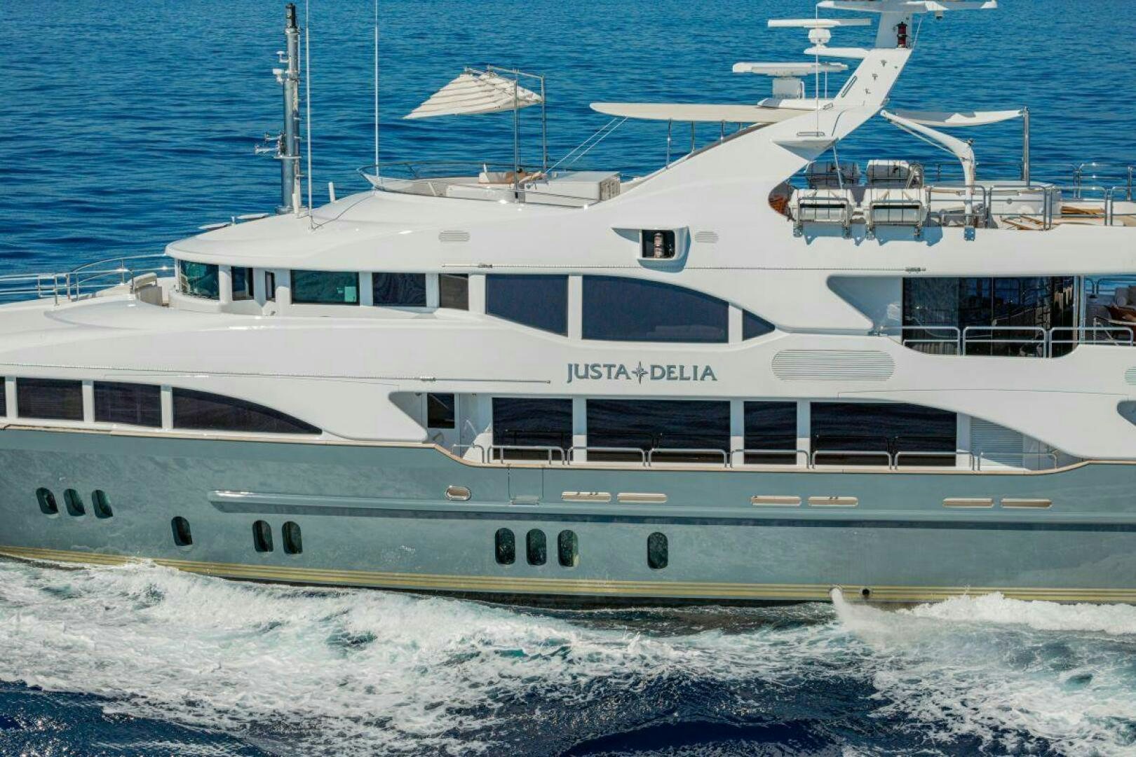 a white yacht in the water aboard JUSTA DELIA Yacht for Sale
