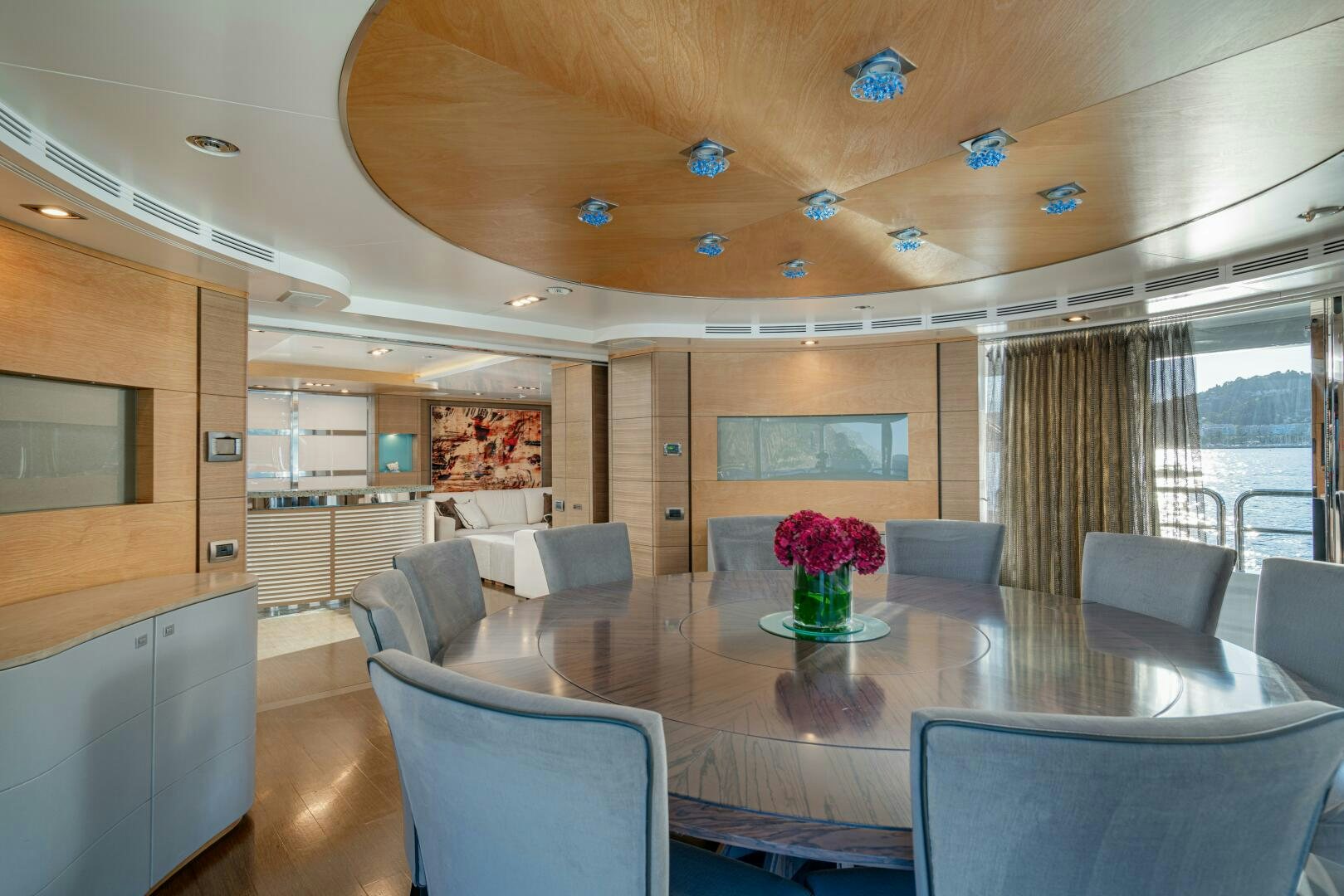 a large room with a table and chairs aboard JUSTA DELIA Yacht for Sale