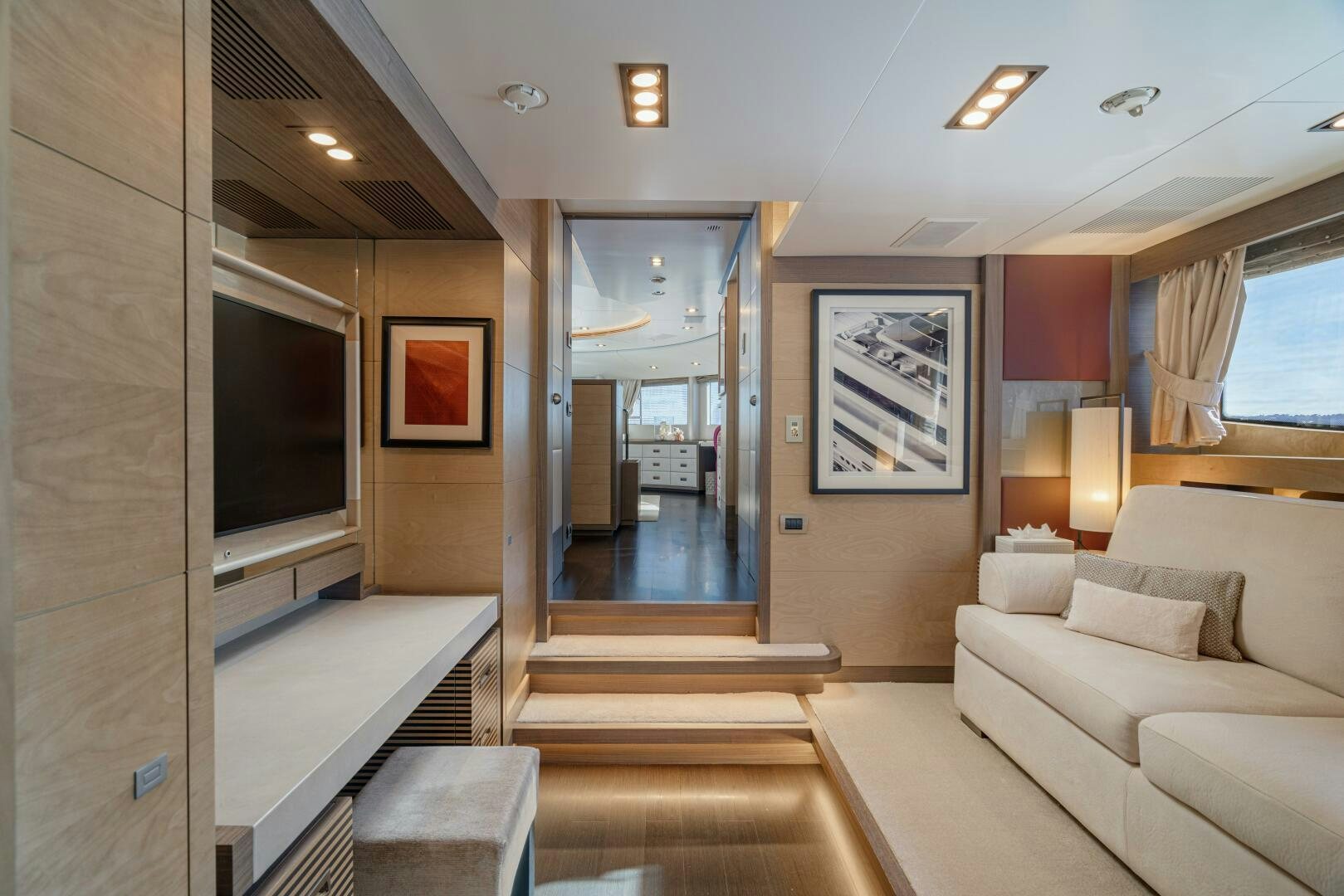 a living room with a couch and a tv aboard JUSTA DELIA Yacht for Sale